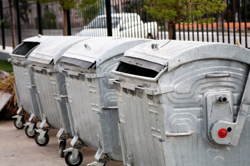 Professional waste clearance team managing construction debris